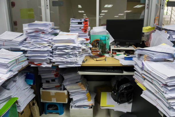 istock Busy, messy and cluttered workplace, full of documents 1325754062