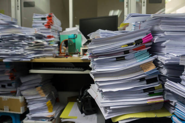istock Busy, messy and cluttered workplace, full of documents 1325754075