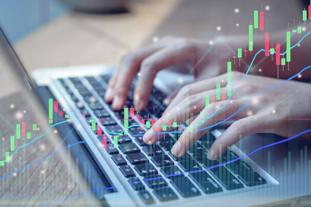 istock Business hands or stock trader analyzing stock graph chart forex charts by indicator using a laptop to buy or sell the stock, double exposure graph, internet trading, investment 1325757992