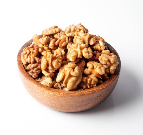 istock Close-up walnuts in bowl.On white background 1325759342
