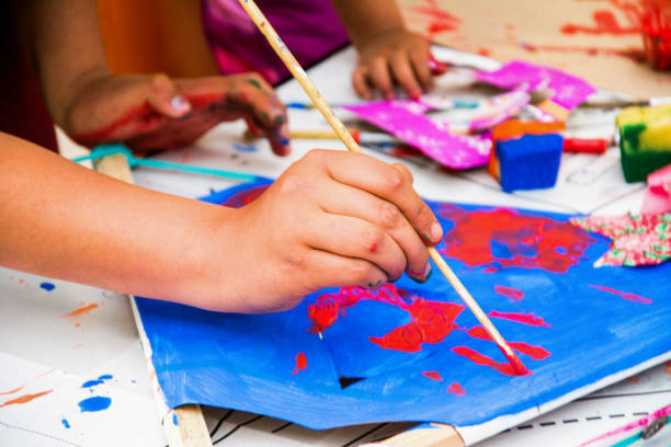 child hands painting stock photo