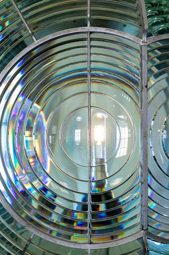 A demonstration electric light shows how the Point Arena Lighthouse fresnel lens focuses light. Point Arena, California, USA