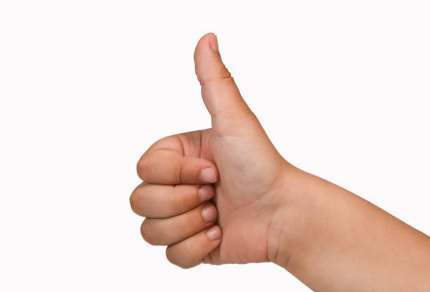 istock Children hand showing like gesture, isolated, white background 1325764851