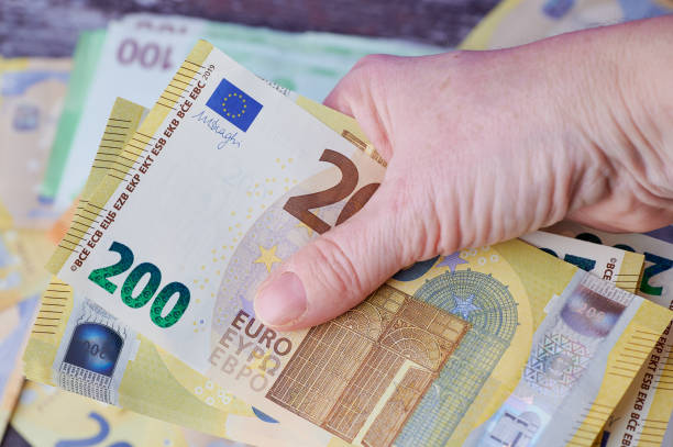woman hand close up with Euro banknotes stock photo