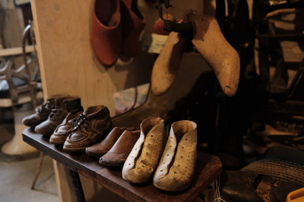 istock old workshop of a cobbler shoemaker with old shoes and patterns and work tools 1325768941