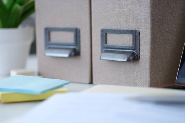 Folders for papers and colorful stickers lying on table closeup