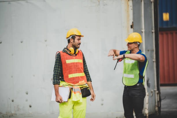 istock logistic worker teamwork and partner of foreman, engineer, and businessman working in an international shipping area, concept of business industrial and working in container yard to import and export 1325771910