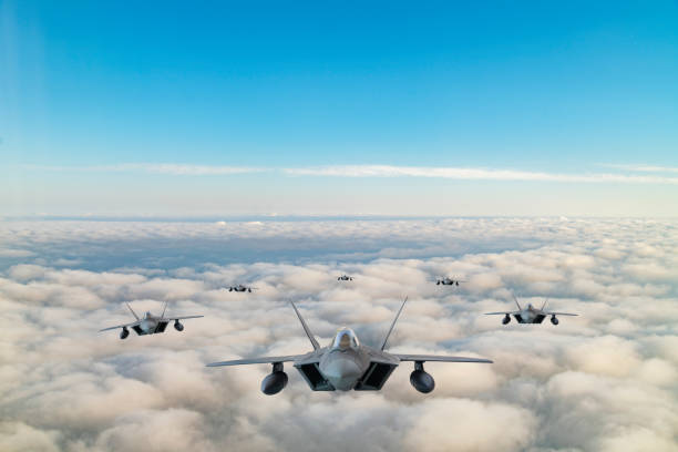 istock Jet fighters flying over the clouds. 1325772031
