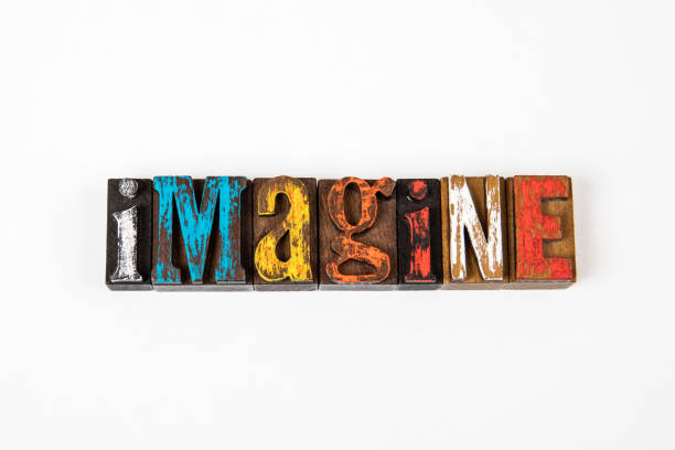 istock IMAGINE. Colored wooden alphabet letters on a white background 1325772047