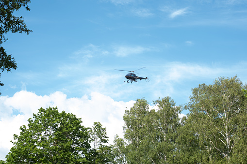 Pärnu, Estonia - June 5, 2021: Helicopter parked in front of Hedon Spa Hotel during beautiful sunny summer day.