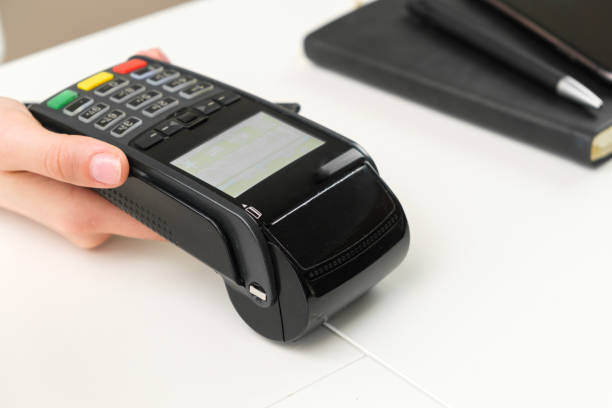 istock Female hand holding pos terminal for contactless payment. 1325781877