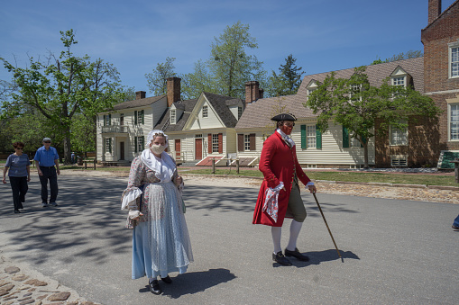 Williamsburg, Virginia, April 27th, 2021: Facial masks are required for visiting the Colonial Williamsburg historic site, both staff and tourists during COVID.