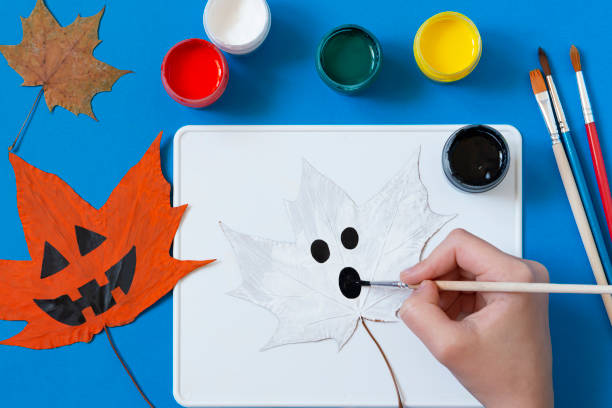 istock Drawing Halloween characters on dry autumn leaves. Step 8 1325783751