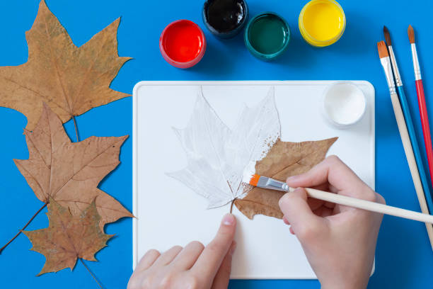 istock Drawing Halloween characters on dry autumn leaves. Step 7 1325783756