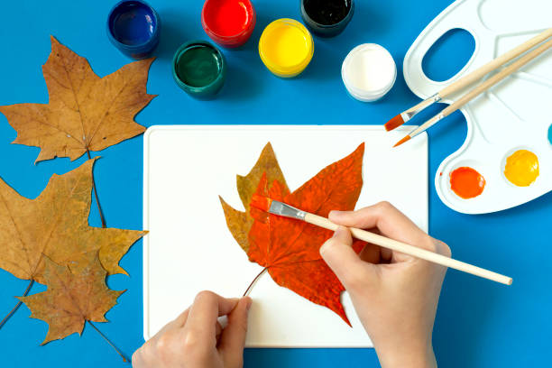 istock Drawing Halloween characters on dry autumn leaves. Step 2 1325783762