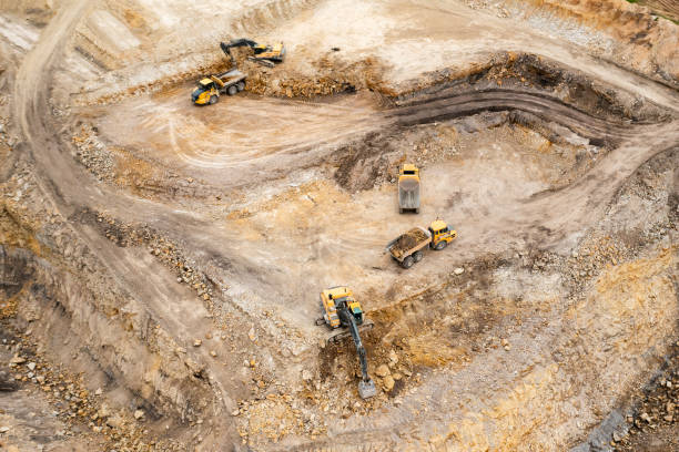 istock Aerial view of excavators digging ground. Opencast mining quarry. 1325784748