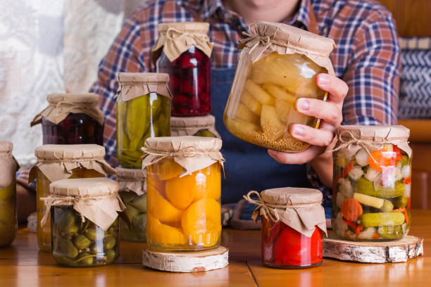 istock Young man holding in hands preserved food 1325786912