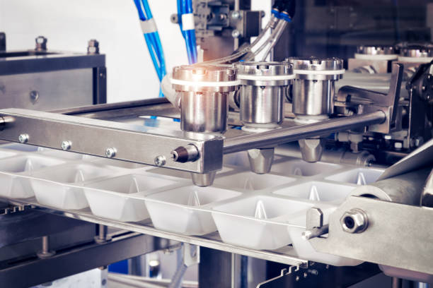 istock Conveyor Filling and Packaging Machine for Food. product packaging concept 1325790870