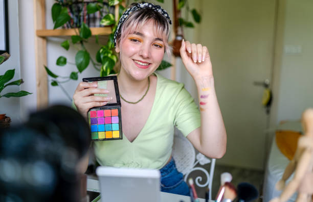 istock Young Woman vlogging about makeup at home 1325791689
