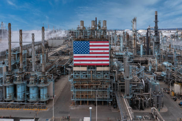 istock American flag on oil refinery plant. 1325791966