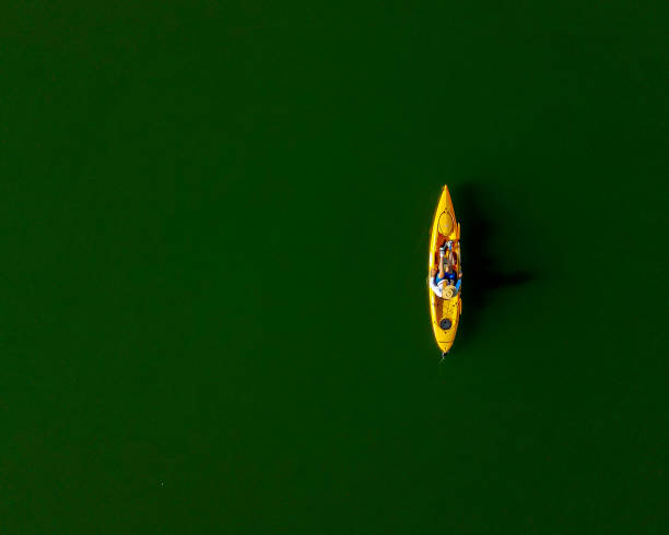 istock Kayaking on a calm lake in the morning 1325796627