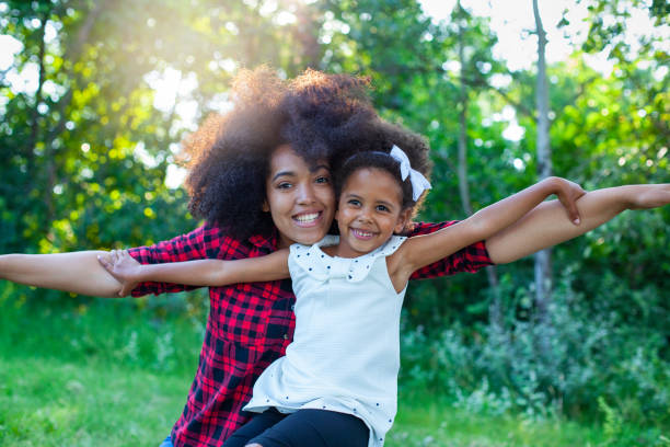 istock Mother and daughter flying 1325797306