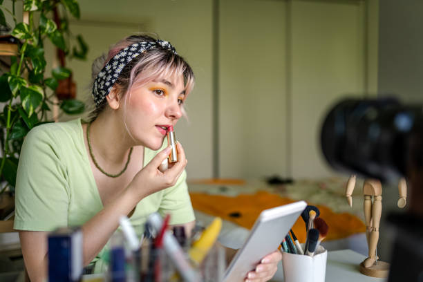 istock Young Woman vlogging about makeup at home 1325797571
