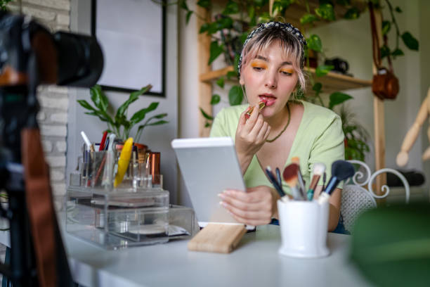 istock Young Woman vlogging about makeup at home 1325798478