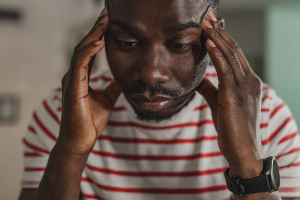 istock Young guy has a stressful day and headache 1325798579