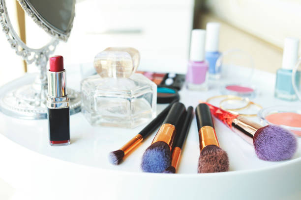 istock Set of makeup cosmetics with brushes and mirror on table 1325799548