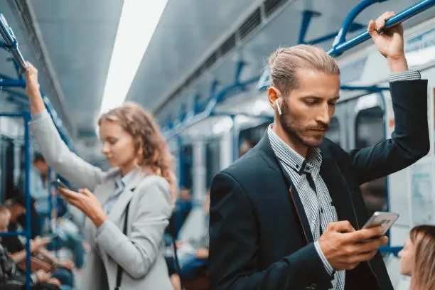 passengers in a subway car standing at a safe distance . urban lifestyle.