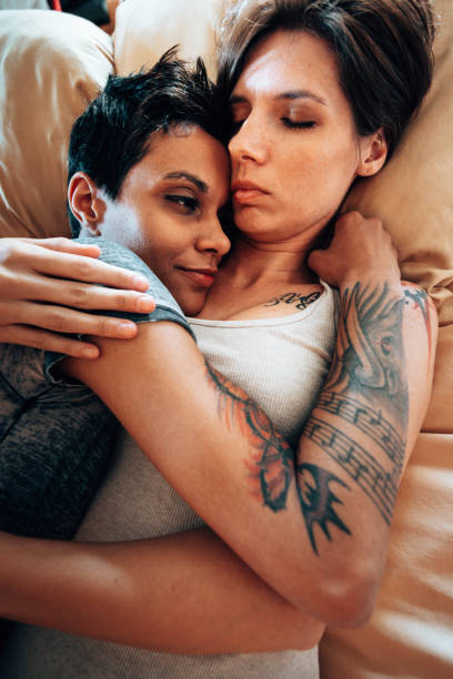 istock lesbian couple sleeping together 1325800544