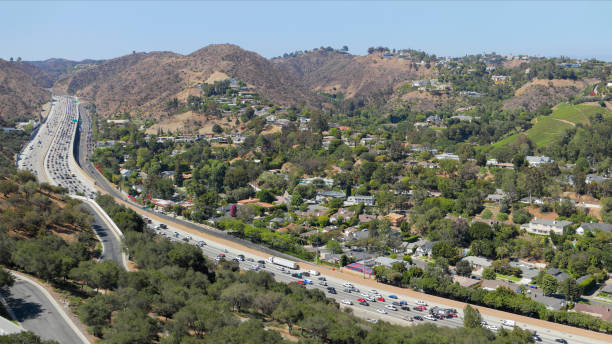 Sepulveda Pass - Interstate 405 - Los Angeles Heavy traffic on the Interstate 405 at the Sepulveda pass. Sepulveda Pass connects the Los Angeles Basin to the San Fernando Valley through the Santa Monica Mountains in Los Angeles. highway 405 photos stock pictures, royalty-free photos & images