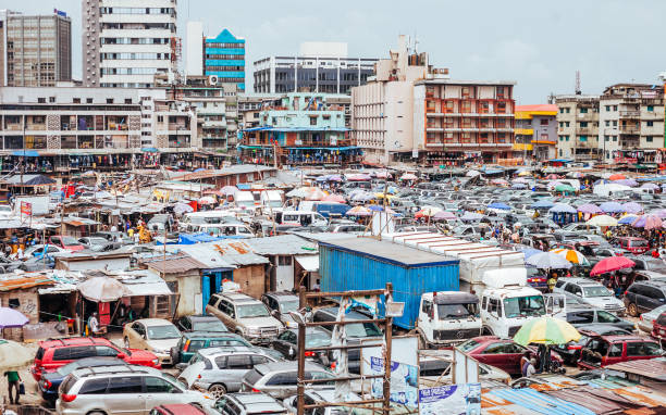 Busy market in Lagos, Nigeria. Balogun market streets. Lagos, Nigeria. car city urban scene commuter stock pictures, royalty-free photos & images