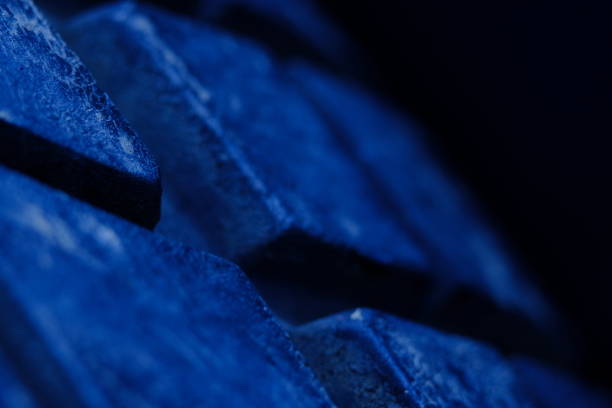 istock Abstract macro photography, close up tire texture pattern with blue light. 1325805447