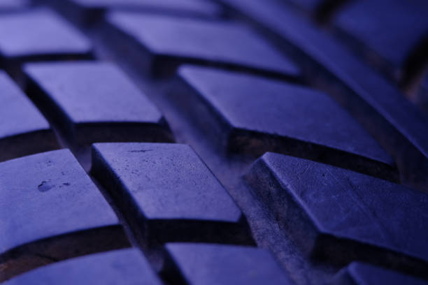 abstract macro photography. close up tire texture pattern with purple light - truck wheel car macro imagens e fotografias de stock