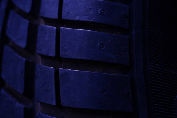 istock Abstract macro photography. Close up tire texture pattern with purple light 1325805973