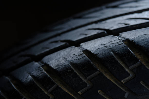 abstract macro photography, close up old tire texture pattern with highlight - truck wheel car macro imagens e fotografias de stock
