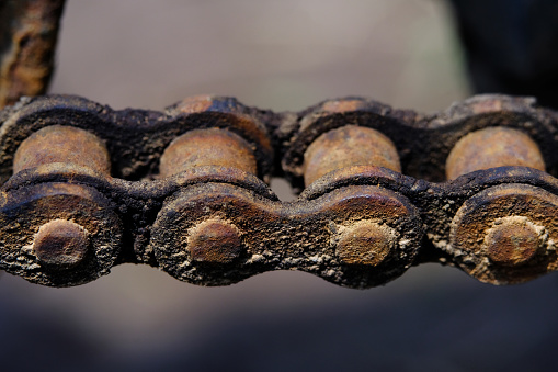 Detail macro photography. Close up shoot of rustic vintage motorcycle wheel chain. Image photo