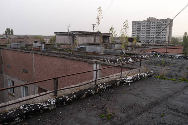 istock Roof in abandoned ghost town Pripyat, post apocalyptic city 1325810290