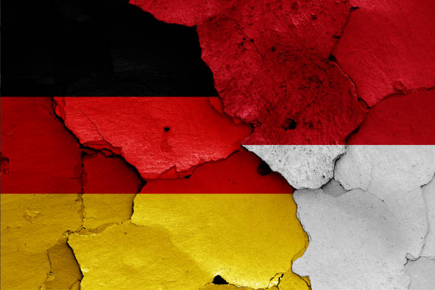 istock flags of Germany and Indonesia painted on cracked wall 1325818169
