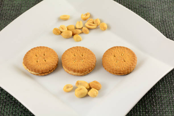 almond cookie with a single bite (and crumbs)