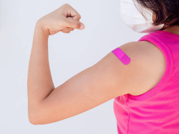 istock Vaccinations, bandage plaster on vaccinated people's arm concept. 1325824624