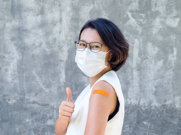 istock Vaccinations, bandage plaster on vaccinated people's arm concept. 1325824639
