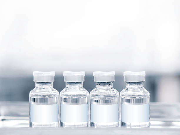 istock Medical vaccine vial with white blank label. 1325826767