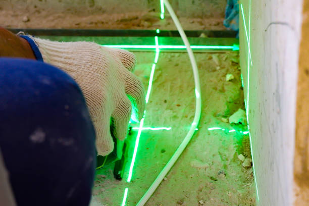 istock the builder measures the repair lines using a green laser level 1325828251
