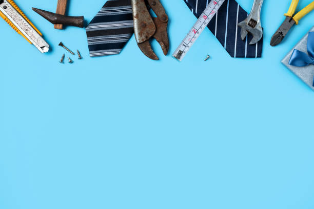 Top view design concept of Father's day with working tools on blue background.