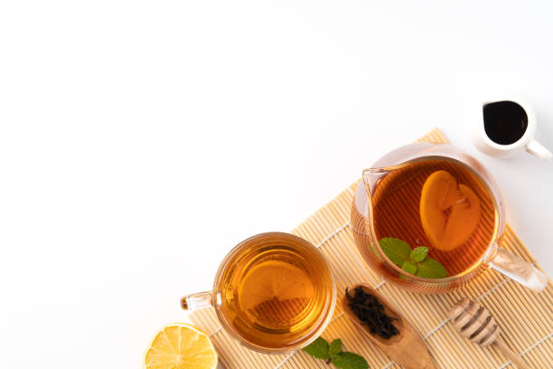 istock Design concept top view of honey black tea with lemon and mint. 1325828729