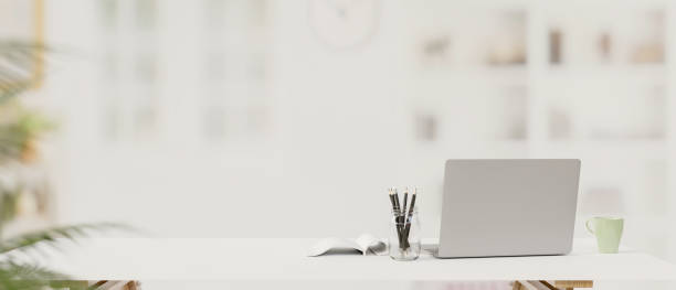 istock Laptop, stationery and copy space on the table with blur background, 3D rendering 1325830348