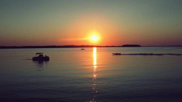 istock Boats on the Water during a Summer Sunset 1325830503